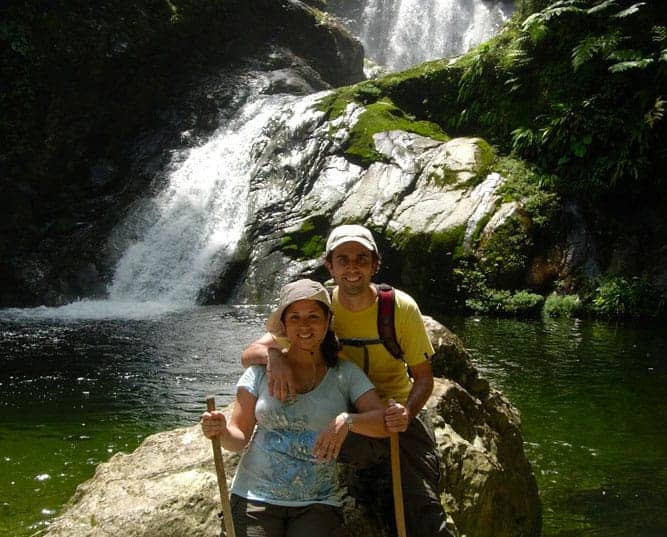 Darius and Shana in front of waterfall in Honduras